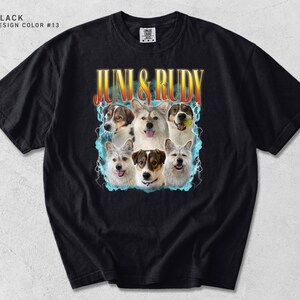 Pu&ograve; includere: T-shirt nero con una grafica di sei cani e la scritta "JUNI & RUDY" in un font retr&ograve;. Il design include un bordo blu e bianco attorno ai cani. La maglietta ha anche la scritta "BLACK DESIGN COLOR #13".
