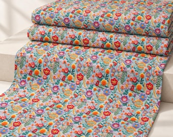 May include: A light blue fabric featuring a dense, multi-colored floral embroidery pattern. The design includes various small flowers in shades of red, orange, yellow, purple, and pink, interspersed with green leafy stems and vines throughout.