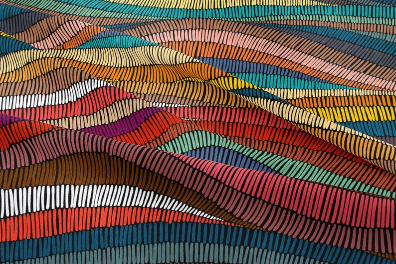 May include: Abstract colorful fabric with a wavy striped pattern. The fabric is made of a soft, textured material and features a variety of colors, including red, orange, yellow, green, blue, and purple.