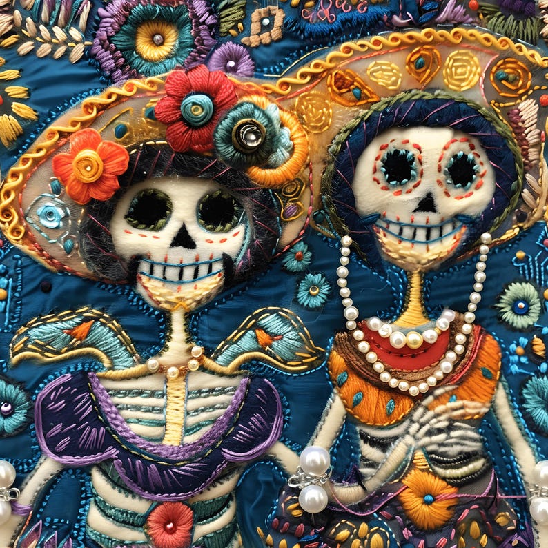 May include: Two embroidered skeletons wearing colorful hats and necklaces. The skeletons are smiling and have large eyes. The background is a dark blue fabric with floral embroidery.