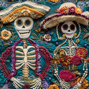 May include: Two embroidered skeletons wearing hats and traditional Mexican Day of the Dead clothing. The skeletons are decorated with colorful flowers, beads, and lace.