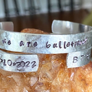 WE ARE BULLETPROOF inspired stamped metal cuff bracelet