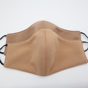 Tan and Dark Tan face mask available in small and medium sizes with filter pocket or reversible adjustable face mask.