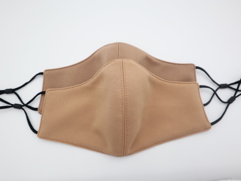 Tan and Dark Tan face mask available in small and medium sizes with filter pocket or reversible adjustable face mask.