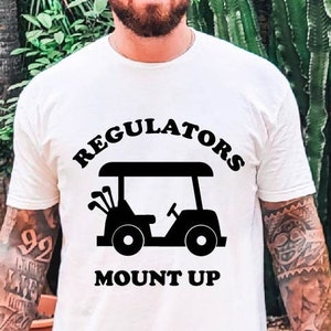 Regulators Mount Up Golf Cart Unisex Softstyle T-Shirt | Kije golfowe | Piłki golfowe | Hole in One | Fairway | Pin | Zabawna koszulka golfowa