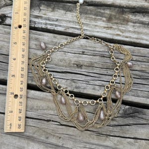Vintage multi-strand gold tone chain necklace with hanging pearls