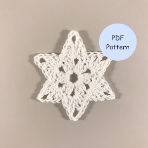 May include: A white crocheted snowflake ornament. PDF Pattern.