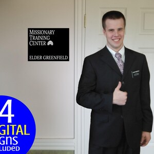 May include: A black square sign with white text that reads "MISSIONARY TRAINING CENTER" and "ELDER GREENFIELD". A blue circle with white text that reads "14 DIGITAL SIGNS INCLUDED". A person in a black suit gives a thumbs up.