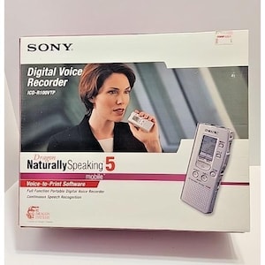 May include: A Sony Digital Voice Recorder ICD-R100VTP box featuring Dragon NaturallySpeaking 5 mobile voice-to-print software. The packaging displays a person holding a silver digital voice recorder, with the device also shown separately.
