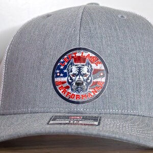 Left lane performance American Flag design on a Richardson 112 trucker style hat with snapback adjustment. Unique design on popular hat