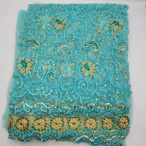 George fabric net neatly embroidered with free lining. Net george with stones pearls.  Blue color