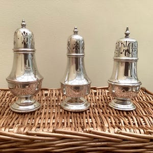 A Selection Of Three Vintage Silver Plated Sugar Shakers