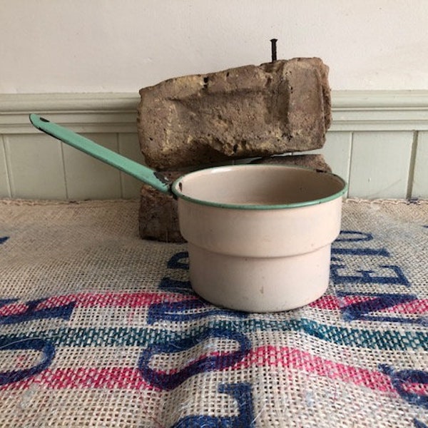 Pale Cream Enamel Sauce Pan With Pale Green Rim And Handle