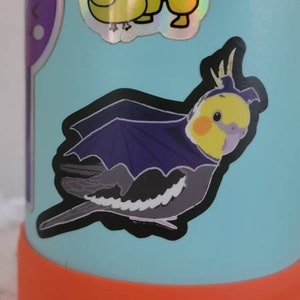 Cockatiel in a bat costume vinyl sticker