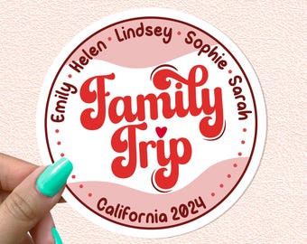 May include: White round sticker with red and pink accents. The sticker says "Family Trip" in a retro font with a small red heart. The names Emily, Helen, Lindsey, Sophie, and Sarah are listed around the edge of the sticker. The text "California 2024" is at the bottom of the sticker.