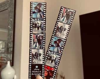 May include: A black and white photo strip bookmark with a Christmas message that reads "Merry Christmas to the best sister". The bookmark features photos of people wearing face masks.