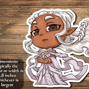 May include: A sticker featuring a cartoon illustration of a woman with long white hair, wearing a white dress with gold accents. The sticker is approximately 2.8 inches in size.