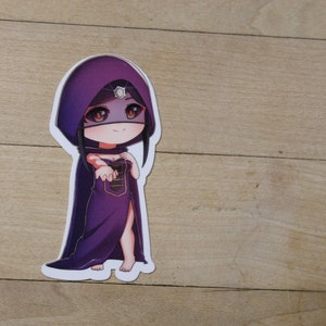May include: A sticker of a cartoon character wearing a purple hooded cloak and a purple dress. The character has long black hair and brown eyes. The character is smiling and holding out their hand.
