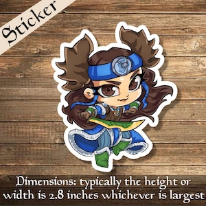 May include: A sticker depicting a cartoon warrior with brown hair, a blue headband, and a determined expression. The warrior wears blue and green armour and holds a sword. The sticker's dimensions are typically 7.1 cm in height or width.