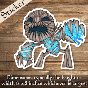 May include: A sticker of a cartoon monster with a wooden body and blue glowing eyes. The monster has a large, toothy mouth and is wrapped in bandages with skull patterns. The sticker is approximately 2.8 inches in size.
