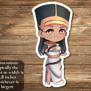 May include: A sticker featuring a cartoon illustration of a woman with dark skin wearing a white dress and a gold crown. She is holding a snake in each hand. The sticker is on a wooden background. Dimensions: typically the height or width is 2.8 inches whichever is largest.