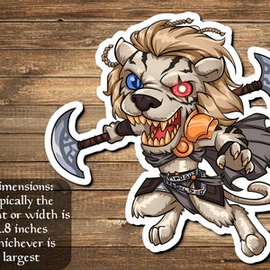 May include: A sticker depicting a cartoon lion-like character with a fierce expression, holding two axes. The character is a mix of tan, orange, and grey. The sticker's dimensions are typically 7.1 cm in height or width, whichever is largest.