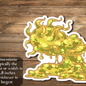 May include: A yellow and green slime monster sticker with a white border. The sticker is approximately 2.8 inches in height or width, whichever is largest.