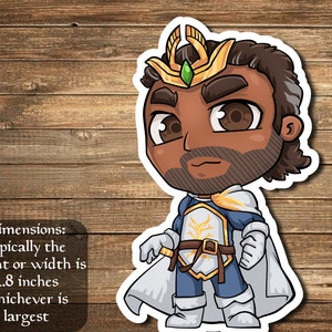 May include: A cartoon illustration of a person wearing a gold crown, white and blue armor, and a white cape. The person has brown skin, a beard, and brown hair. The image is on a wood background.
