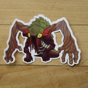 May include: A sticker featuring a cartoon monster with a green mossy body, red and brown limbs, and glowing yellow eyes. The monster has a skeletal appearance and is dripping with red liquid.