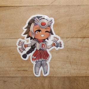 May include: A white sticker with a cartoon illustration of a female character with brown hair, wearing a white and red outfit with a red headband and a white and red feathered headdress. The character is winking and holding two white and red feathered fans.