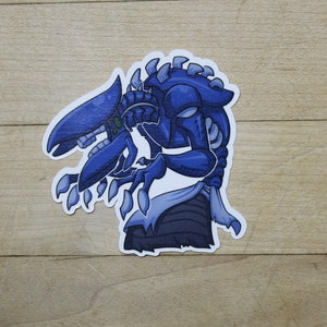 May include: A blue and white cartoon alien sticker with a menacing expression. The alien has a long, thin body with sharp claws and a large head with a single eye.