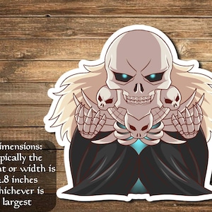 May include: A sticker featuring a cartoon skeleton with a blue glow, wearing a black robe and holding a bone in each hand. The skeleton has a skull with a large grin and glowing blue eyes. The sticker is approximately 2.8 inches in size.