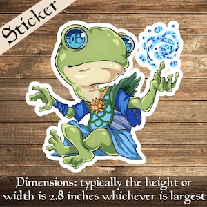 May include: A green frog wearing a blue and green outfit with a blue and white lotus flower on its chest. The frog is holding a blue swirling orb in its right hand. The frog is sitting on a wooden surface. The image is a sticker.