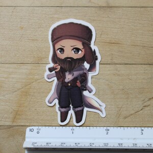 May include: A cartoon sticker of a man with a beard wearing a brown hat and a white coat holding a small axe. He is standing on a white background.