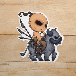 May include: A cartoon illustration of a bald, muscular man with a ponytail riding a gray, furry creature with horns. The man is holding a spear and wearing a loincloth. The creature has a fierce expression.