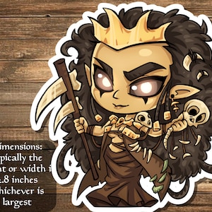 May include: A sticker featuring a cartoon character with a gold crown, holding a scythe and bones. The character has dark hair and is wearing a brown robe. The sticker is approximately 2.8 inches in height or width.