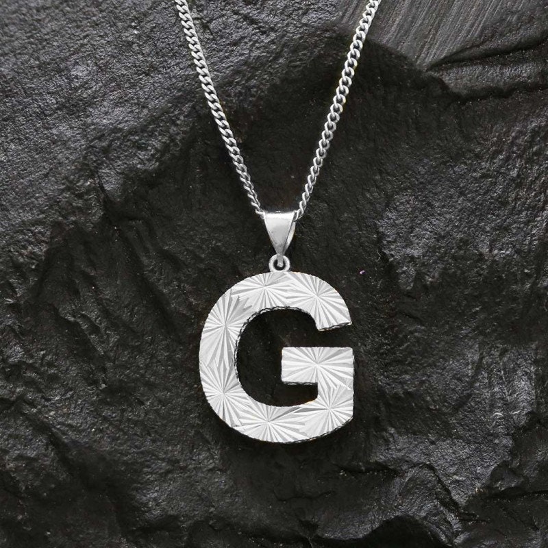 Silver g sale pendant