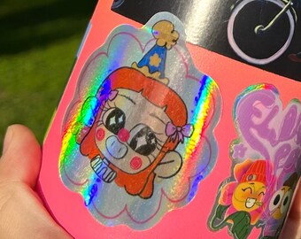 May include: Pink reusable water bottle with various colorful stickers. One sticker features a cartoon character with red hair wearing a party hat. Another sticker features a cartoon character with a green hat and a yellow body.