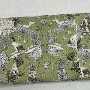 May include: A green kantha quilt with a white and brown floral and animal print. The print features monkeys, birds, tigers, and deer.