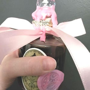Handcrafted Pink Potion Bottle: Witchy Cosplay Prop with Charm