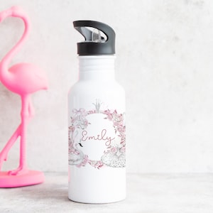 May include: White water bottle with a black lid and a pink floral design featuring swans and the name "Emily".