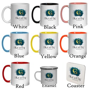 May include: Collection of white ceramic mugs with colored handles and rims, including white, black, pink, blue, yellow, orange, and red. Each mug features a teal and gold design with the text "The Krafty Goose". Also includes an enamel mug and a coaster.