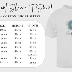 May include: White short sleeve t-shirt with a logo and size chart. The chart lists sizes for children aged 6-12 months to 9-10 years, with height and width measurements in centimeters. The shirt is 100% cotton.