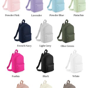 a bunch of different colored backpacks on a white background