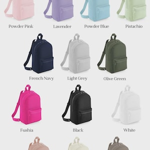 May include: A display of backpacks in various colors, including powder pink, lavender, powder blue, and pistachio. Other colors are French navy, light grey, olive green, fushia, black, white, peach, natural, and mushroom. The text "BACKPACK COLOURS" is at the top.
