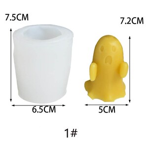 May include: A white silicone mold shaped like a ghost, measuring 7.5 cm tall and 6.5 cm wide. A yellow ghost-shaped candle measuring 7.2 cm tall and 5 cm wide is shown next to the mold. The text "1#" is printed below the image.