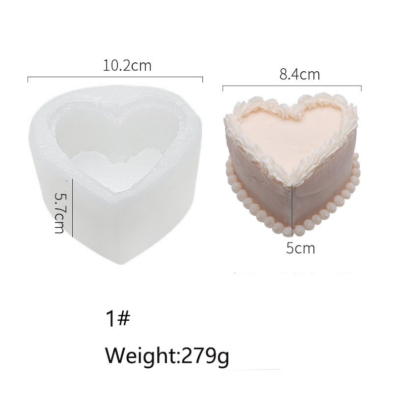 K&ouml;nnte beinhalten: Eine wei&szlig;e herzf&ouml;rmige Silikonform zum Backen von Kuchen, 10,2 cm breit und 5,7 cm hoch. Daneben ein rosa herzf&ouml;rmiger Kuchen mit wei&szlig;em Frosting, 8,4 cm breit und 5 cm hoch. Der Text "1# Gewicht: 279 g" ist unter den Formen gedruckt.