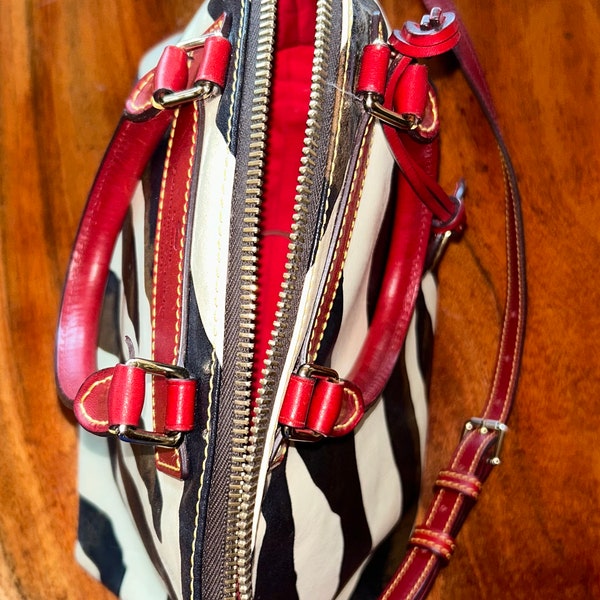 Dooney and Bourke Florentine zebra print genuine Vacchetta leather crossbody satchel dome handbag in excellent condition