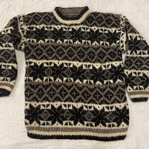 Nepal made all wool bulky vintage large sweater in browns/beige/ creamy off white with snowflakes /stars pattern. Guessing this is hand made
