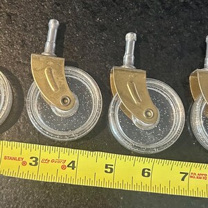 Acrylic/metal roller cart wheel replacements. Four total in nice condition.See photos with measurements